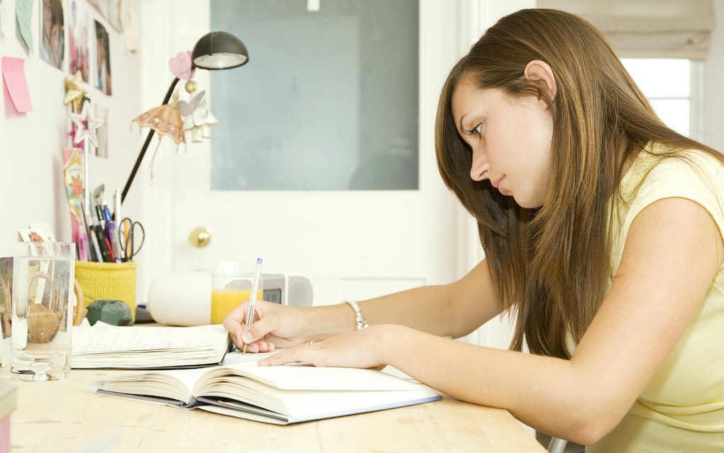 Girl doing homework for exam preparation tips - Mykidstime
