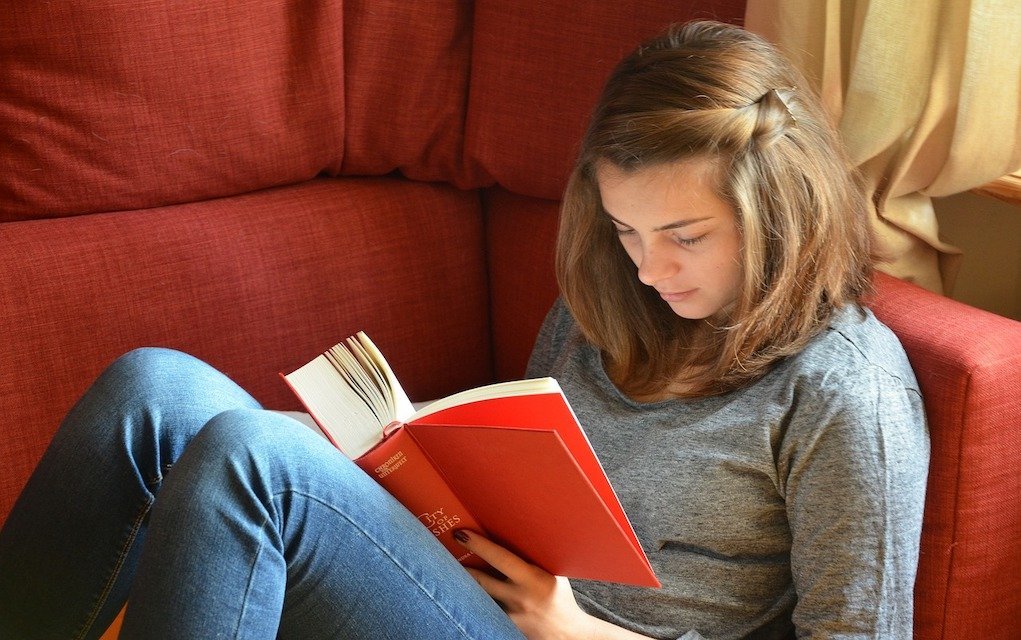 Teen reading a book Christmas gift ideas for teens