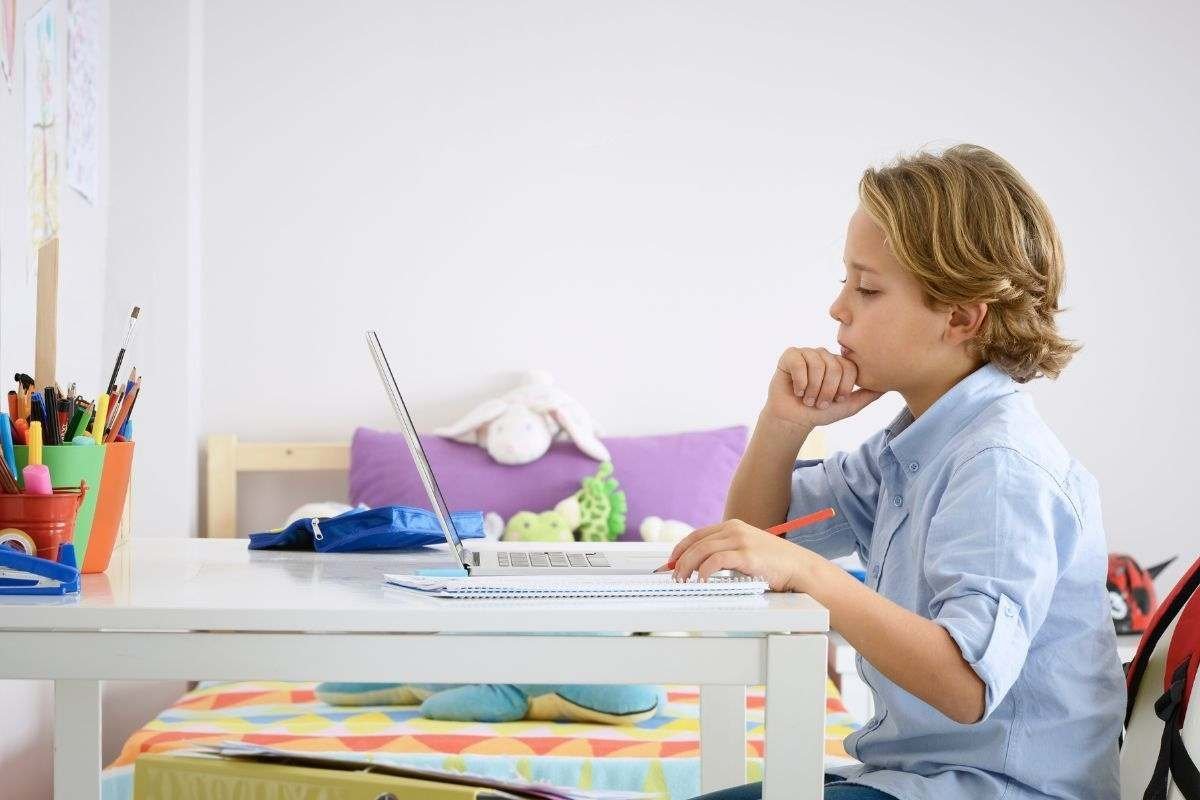 child doing math puzzles avoiding summer slide child doing math puzzles avoiding summer slide