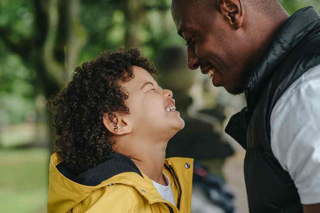 child and dad laughing family walk